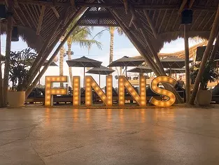 Finns beach club sign
